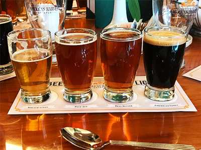 Four beers lined up on a table