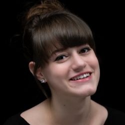 Professional headshot of a smiling woman