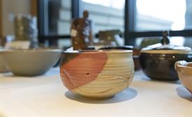Handmade orange and brown pottery bowl