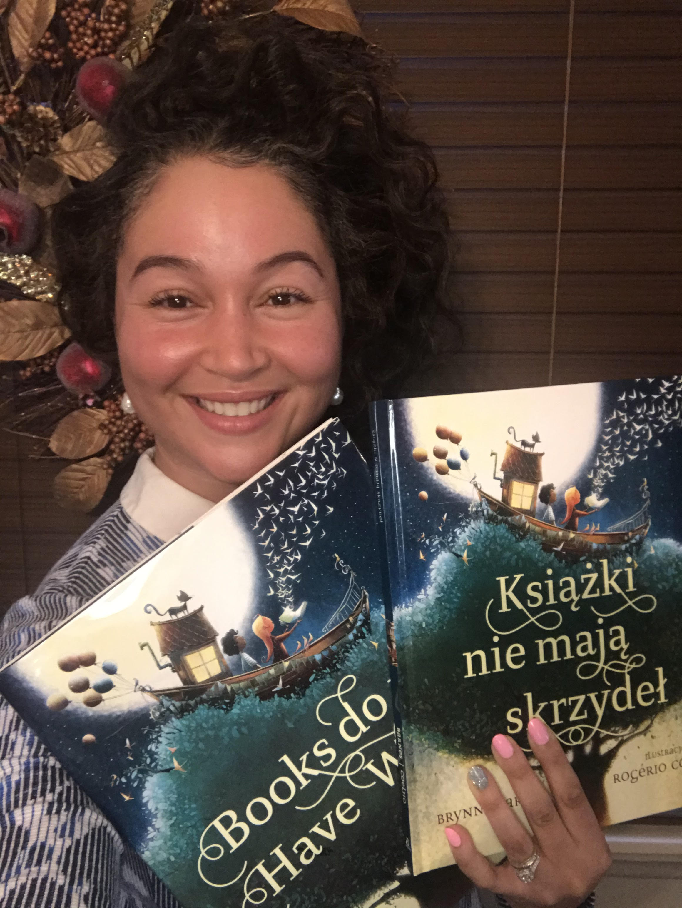 Brynne Barnes holding a Polish translated book