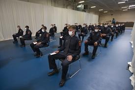 Students of the Fire Academy sitting during graduation ceremony