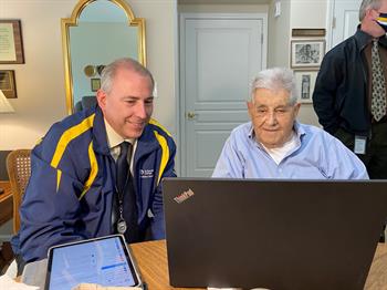 Dr. Cerny and Frank Angileri reviewing plans at a computer