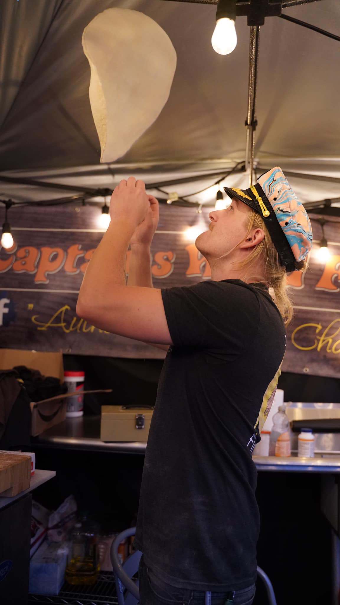 Nick Mannisto tossing pizza