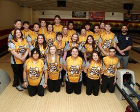 Team photo of the Schoolcraft College bowling team inside an alley setting
