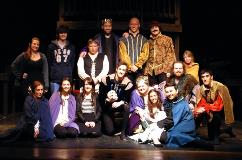 A group photo of the actors and participants in a production.