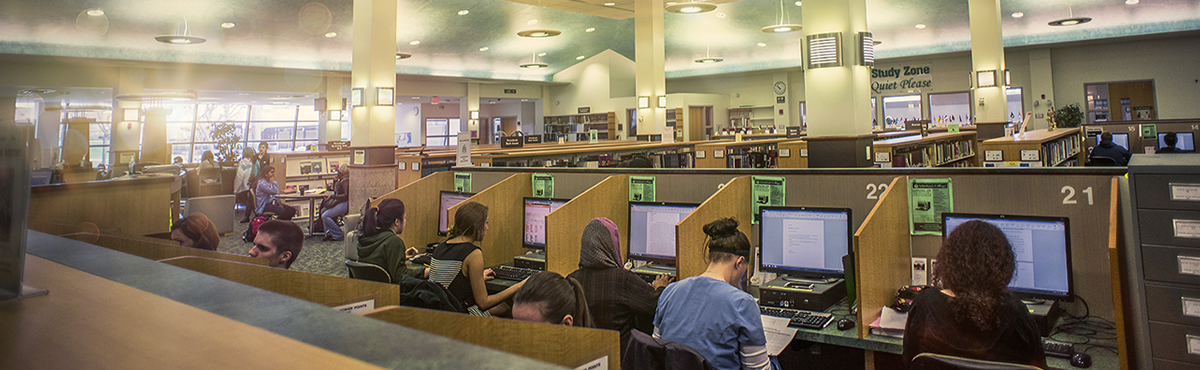 Photo of students studying at a library